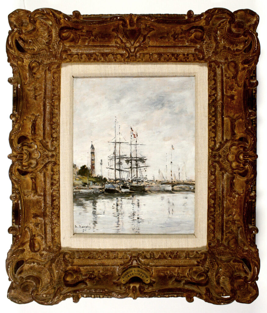 ornate frame with image of boats by the shore