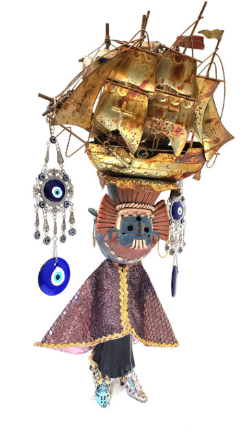 sculpture of glitter, beads, wax and found objects