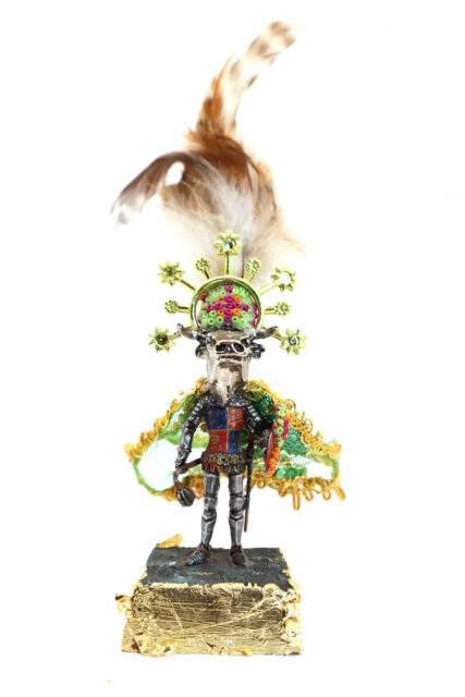 sculpture of glitter, beads, wax and found objects