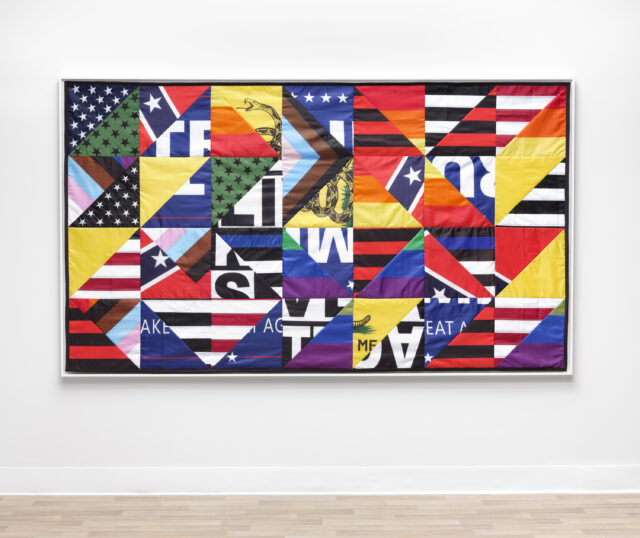 Vibrant quilt-like artwork with stars, stripes, and fragments of the American flag in bold colors and patterns.