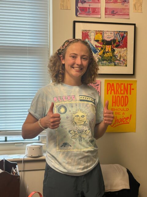 Student with art in their room