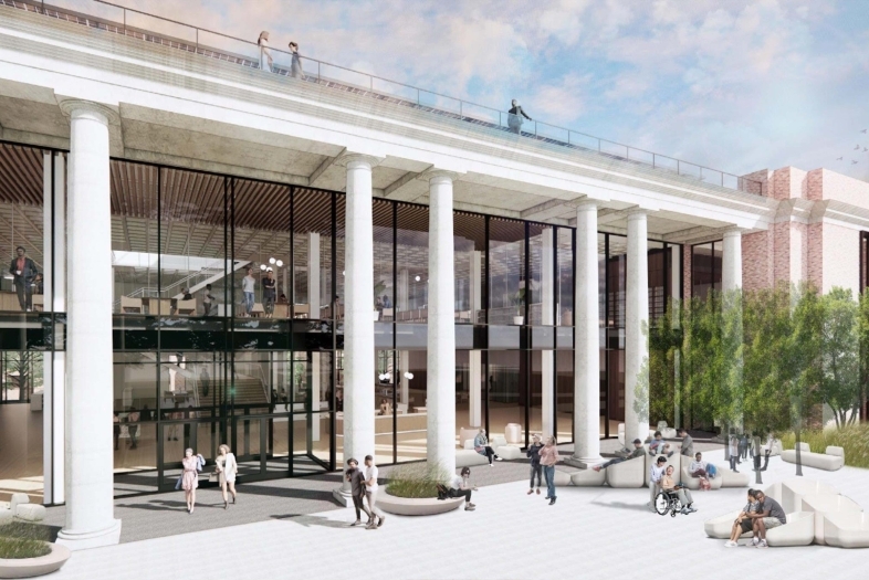 An architectural rendering of a multi-story building featuring a large glass facade positioned behind a row of tall, white classical columns. Above the columns, a rooftop terrace with a glass railing is visible, with several figures standing along the edge. The ground-level plaza features people walking, standing, and sitting on modern, light-colored benches. The building's interior, showing multiple levels and figures, is visible through the glass walls, and a portion of a brick structure is visible on the right side.